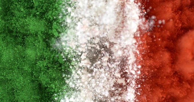 Super slow motion close up of Italian flag burst of colorful powder with flying particles isolated on black background at 1000 fps.
