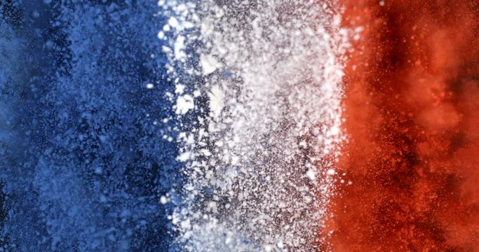 Super slow motion close up of France flag burst of colorful powder with flying particles isolated on black background at 1000 fps.