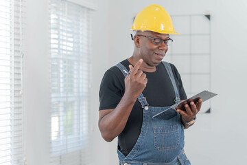 Professional of man architect industrial engineer Standing in the office, foreman in helmet using...