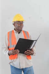  engineer handsome man or architect looking forward with white safety helmet in the office.