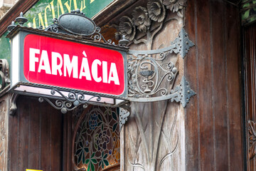 Modernist Pharmacy sign (Farmacia in Spanish), El Eixample neighborhood, Barcelona, Catalonia,...