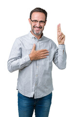 Handsome middle age elegant senior man wearing glasses over isolated background Swearing with hand...