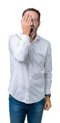 Handsome middle age elegant senior business man wearing glasses over isolated background Yawning tired covering half face, eye and mouth with hand. Face hurts in pain.