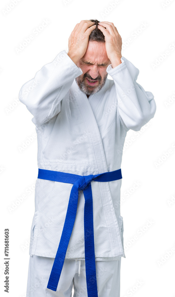 Poster handsome middle age senior man wearing kimono uniform over isolated background suffering from headac