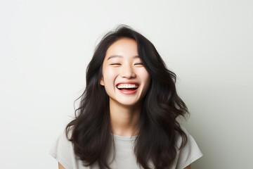 Portrait of a smiling young Asian woman.