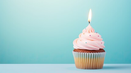 Pastel Pink Frosted Cupcake with Lit Birthday Candle