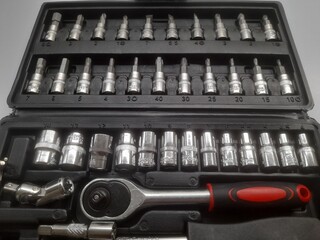 ratchet socket wrench set top view on white background