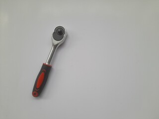ratchet socket wrench handle top view on white background. background concept of transport,...