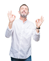 Naklejka premium Middle age hoary senior man over isolated background relax and smiling with eyes closed doing meditation gesture with fingers. Yoga concept.