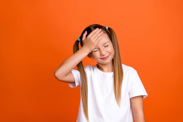 Fototapeta na wymiar Photo portrait of pretty small girl touch forehead migraine dont remember dressed stylish white outfit isolated on orange color background