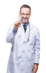 Fototapeta premium Middle age senior hoary doctor man wearing medical uniform isolated background showing and pointing up with finger number one while smiling confident and happy.