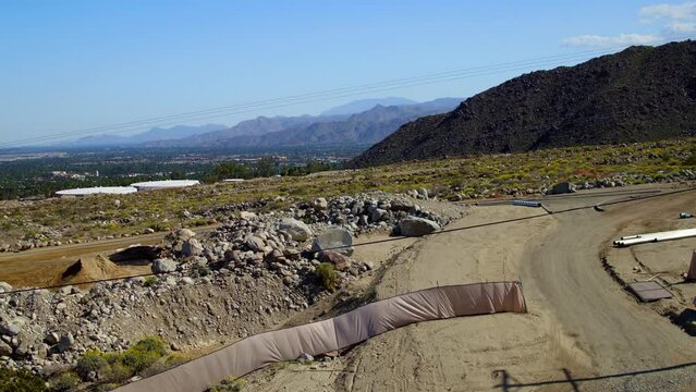 Aerial: Drone Panning Scenic View Of Mountains In Semi Arid Desert On Sunny Day - Palm Springs, California