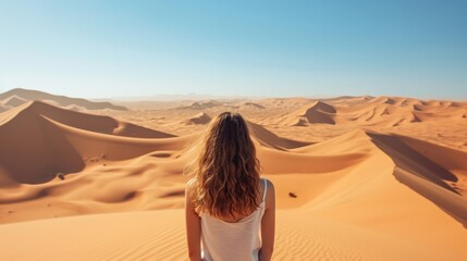 Fototapeta na wymiar Woman from behind, looking at a vast desert landscape generative ai