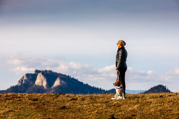 spending time with a dog during a mountain hike