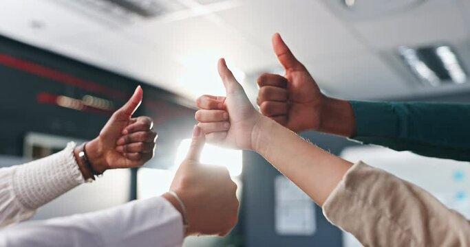 Business people, hands and thumbs up for teamwork, success or good job in unity together at office. Closeup of creative employees with like emoji, yes sign or OK for winning, synergy or group startup