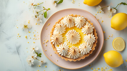 Tartlet with lemon cream and meringue on a soft pastel background. Banner with copy space, showcasing a delightful and citrusy dessert.