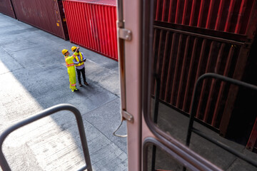 Male container workers working in container logistic shipping dock