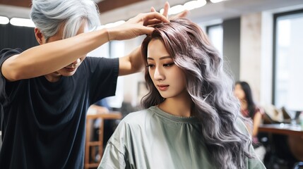 Fototapeta premium Hairdresser working on haircut and hairstyle for client at beauty salon, trendy hairs designs