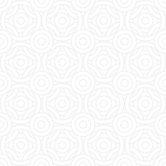 Seamless trendy pattern of circles and arcs, geometric white shapes for textiles and wallpaper. Festive Christmas pattern on a gray background.