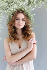 Beautiful blond woman with flowers wreath