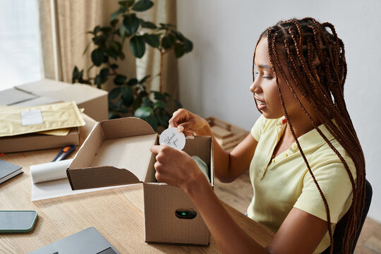 Attractive Young African American Woman Putting Thank You Sticker On Parcel On Work, Delivery