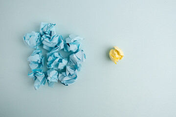 Crumpled paper balls on a colored background. Brainstorming and concept of idea, inspiration and creative ideas
