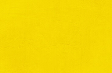 Yellow wall background. Abstract wall surface with yellow plaster texture for design. Close up.