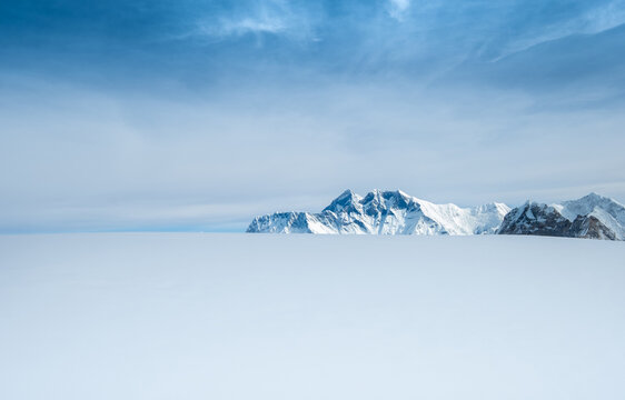 Mount Everest, Nuptse, Lhotse with South Face wall beautiful panoramic shot of a High Himalayas from Mera peak slope snow fields at cca 6000m. Beauty in Nature and extreme sports concept image.