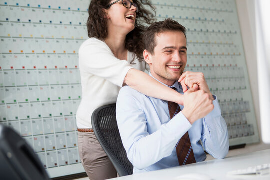 colleagues in love at work making fun