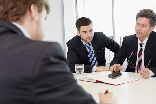 cheerful lawyers meeting in law office 