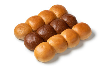 Variation of white and brown buns of bread close up isolated on white background