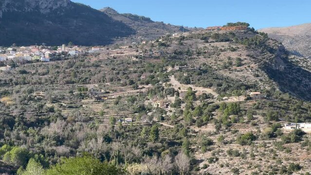 Panoramic view of the Hell's Ravine, or El Barranc de l'Infern, in La Vall de Laguar. One of the hardest hiking routes in Spain. The Cavall Verd mountain and the town Benimaurell are in the background