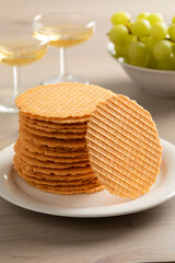 Stack of fresh homemade baked thin cheese waffles as a snack close up