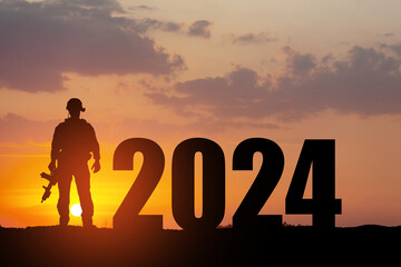 Silhouette of soldier and 2024 against the sunrise or sunset.