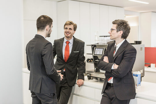 Business men in office kitchen