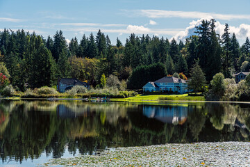 2019-09-30 PHANTOM LAKE WITH A NICE REFLECTION IN THE WATER AND SHORELINE IN BELLEVUE WASHINGTON