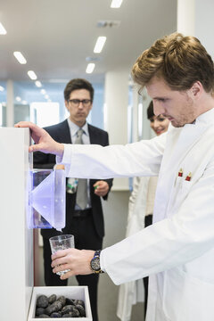 Colleagues at a pharmaceutical company getting drinks together. Munich, Bavaria, Germany