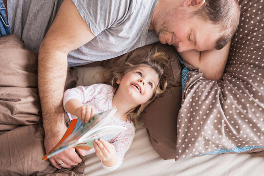 Young girl spending time and playing with her father. Munich, Bavaria, Germany