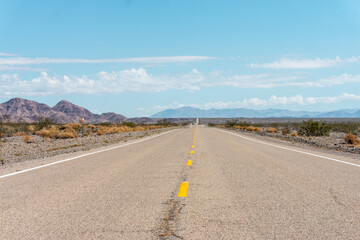 Route 66 leading towards the mountains in Amboy, California.