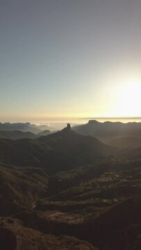Sunset in the ravines of Roque Nublo, Sea of Clouds and Sun Fallen, vertical video in 4K from a Drone, Gran Canaria Canary island