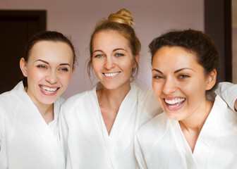 Three young happy women at spa resort