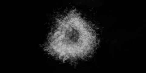 White snow ball made of fluffy snowflakes on a black background. Abstract steam on a black background.