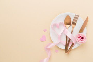 Festive table setting for Valentine's Day on color background, top view