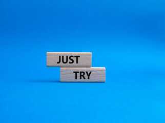 Just try symbol. Concept words Just try on wooden blocks. Beautiful blue background. Business and Just Try concept. Copy space.
