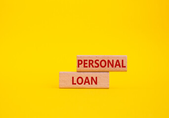 Personal Loan symbol. Concept word Personal Loan on wooden blocks. Beautiful yellow background....