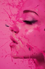 Pink paint splashes on profile of a  female face in close up