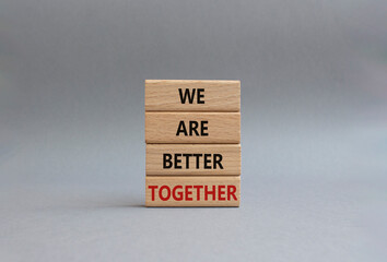 We are better together symbol. Wooden blocks with words We are better together. Beautiful grey background. We are better together concept. Copy space.