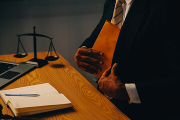Judge gavel with Justice lawyers having team meeting at law firm background. Concepts of Law and...