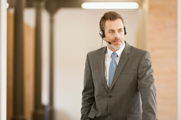 Motivational speaker and business coach holding a business coaching seminar for young professionals at a start-up business.