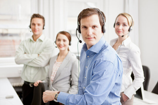 Colleagues working in a call center with a very friendly atmosphere. Munich, Germany